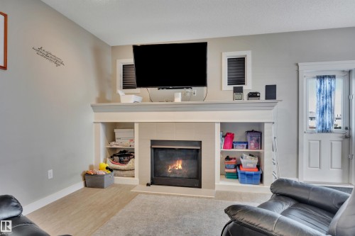 956 Morris Way, Leduc, AB - Indoor Photo Showing Living Room With Fireplace