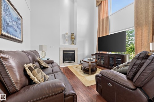 979 Hollingsworth Bend Nw, Edmonton, AB - Indoor Photo Showing Living Room With Fireplace