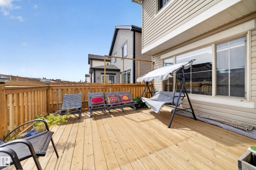Expansive wood-finish deck with a wood privacy fence and exterior siding - 1927 51 Street Sw, Edmonton, AB - Outdoor With Deck Patio Veranda With Exterior