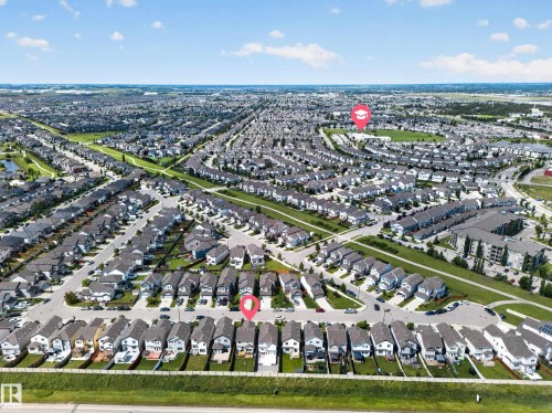 Aerial perspective of a residential neighborhood with detached homes, green spaces, and paved streets - 1927 51 Street Sw, Edmonton, AB - Outdoor With View