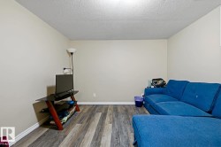 Neutral wall tones, wood-finish flooring, and white trim - 