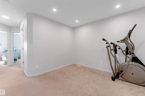 Neutral wall paint tones, recessed ceiling lighting, and carpeted flooring - 1263 Watt Drive Sw, Edmonton, AB - Indoor