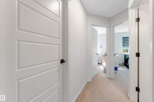 Neutral wall finishes, recessed lighting, and panel doors - 1263 Watt Drive Sw, Edmonton, AB - Indoor Photo Showing Other Room