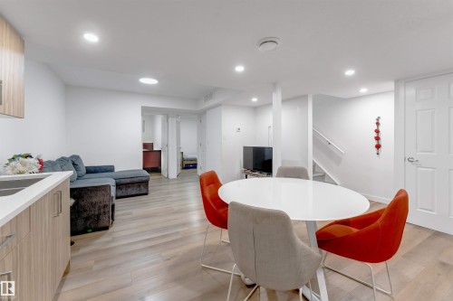Recessed lighting, wood-finish flooring, white paneled doors, and a built-in kitchen counter - 1263 Watt Drive Sw, Edmonton, AB - Indoor