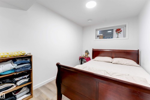 Recessed lighting, light wood-finish flooring, and white walls - 1263 Watt Drive Sw, Edmonton, AB - Indoor Photo Showing Bedroom