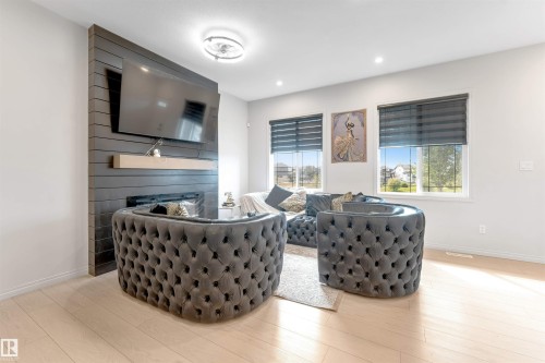 Recessed lighting, light wood-finish flooring, and multiple windows with horizontal blinds - 1263 Watt Drive Sw, Edmonton, AB - Indoor Photo Showing Dining Room