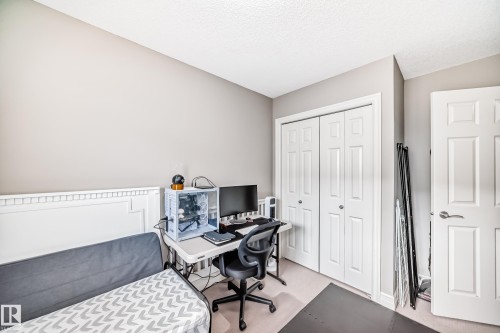 Neutral-toned walls complement the white trim and paneling - #138 655 Tamarack Rd Nw, Edmonton, AB - Indoor Photo Showing Office