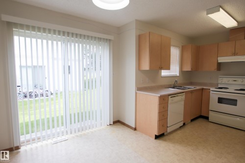 #408 610 King St, Spruce Grove, AB - Indoor Photo Showing Kitchen With Double Sink