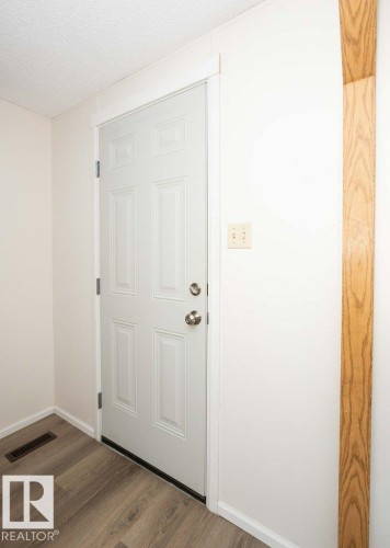 White paneled door with brushed nickel hardware - 26417 Twp Rd 582, Rural Westlock County, AB - Indoor Photo Showing Other Room