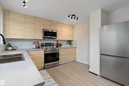 6411 152A Avenue Nw, Edmonton, AB - Indoor Photo Showing Kitchen With Stainless Steel Kitchen With Double Sink