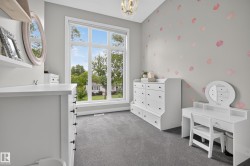 Expansive window with multiple panes, grey wall finish, and overhead lighting fixture - 
