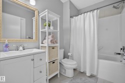 White bath over shower with chrome fixtures - 