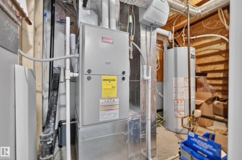 Utility area featuring a furnace and water heater - 11018 122 Street Nw, Edmonton, AB - Indoor Photo Showing Basement