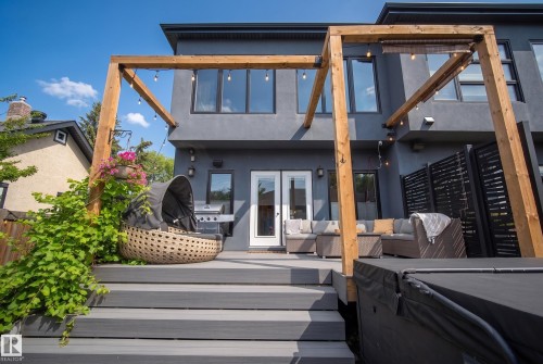 Multi-level composite deck with integrated pergola, privacy screen, and double French patio doors - 11018 122 Street Nw, Edmonton, AB - Outdoor With Deck Patio Veranda