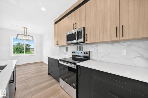 102 Waverly Way, Fort Saskatchewan, AB - Indoor Photo Showing Kitchen With Double Sink