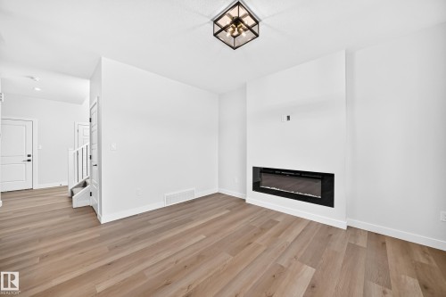 104 Waverly Way, Fort Saskatchewan, AB - Indoor Photo Showing Other Room With Fireplace