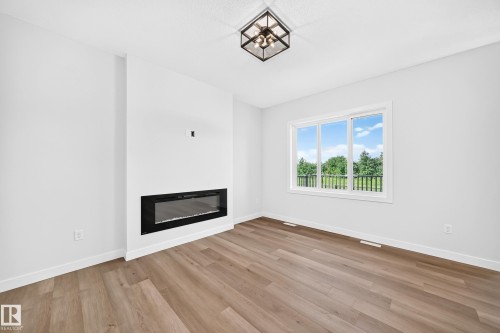104 Waverly Way, Fort Saskatchewan, AB - Indoor Photo Showing Living Room With Fireplace