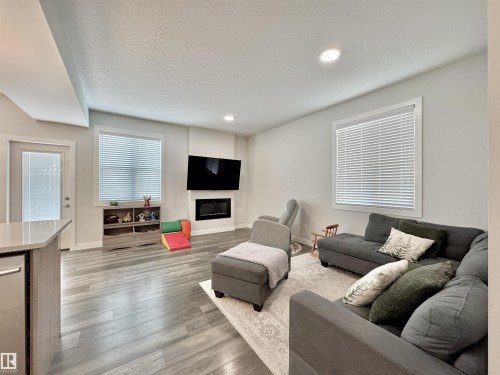 127 Richmond Link, Fort Saskatchewan, AB - Indoor Photo Showing Living Room With Fireplace