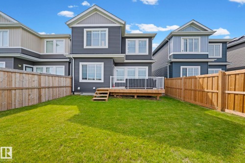 Private fenced yard with a wooden deck and steps - 16128 31 Avenue Sw, Edmonton, AB - Outdoor