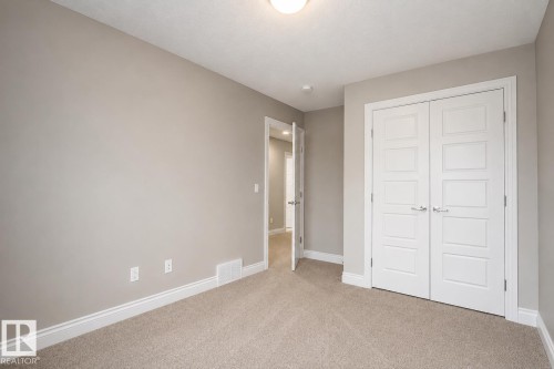 Neutral-toned walls with contrasting white trim - 7274 Morgan Road Nw, Edmonton, AB - Indoor Photo Showing Other Room