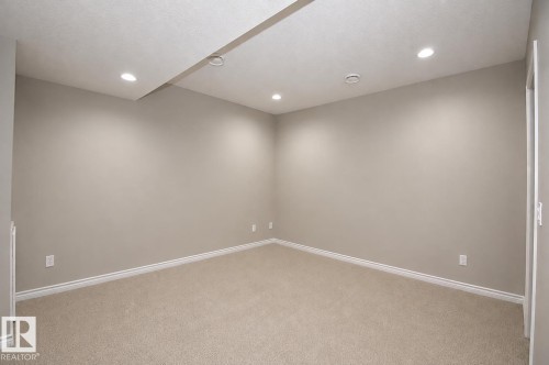 Neutral wall paint, recessed lighting, wall-to-wall carpeting, and white trim - 7274 Morgan Road Nw, Edmonton, AB - Indoor Photo Showing Other Room