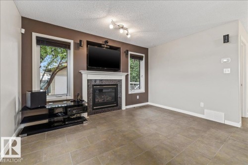 Living room - 1086 Grantham Drive Nw, Edmonton, AB - Indoor Photo Showing Living Room With Fireplace