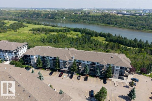 Multi-story residential buildings with surface parking - #307 1188 Hyndman Rd Nw, Edmonton, AB - Outdoor With Body Of Water With View