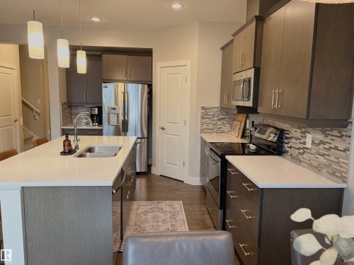 152 Sturtz Bend, Leduc, AB - Indoor Photo Showing Kitchen With Double Sink With Upgraded Kitchen