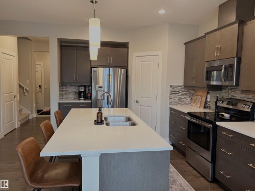152 Sturtz Bend, Leduc, AB - Indoor Photo Showing Kitchen With Double Sink With Upgraded Kitchen