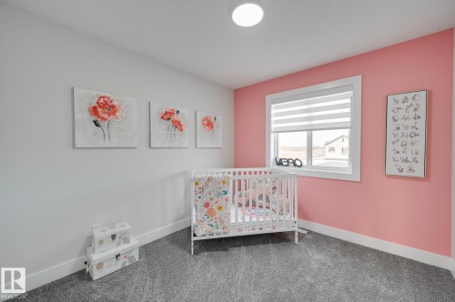 Carpeted flooring, white trim, recessed lighting, and a large window with blinds - 51 Clichy Close, St. Albert, AB - Indoor Photo Showing Bedroom
