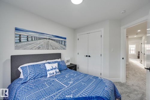 White walls, white trim, and light gray carpeting - 51 Clichy Close, St. Albert, AB - Indoor Photo Showing Bedroom