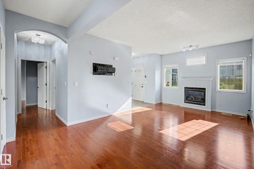 #47 13825 155 Av Nw, Edmonton, AB - Indoor Photo Showing Living Room With Fireplace
