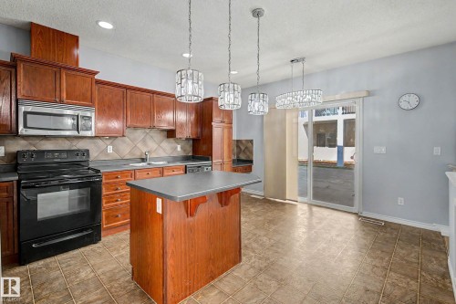 #47 13825 155 Av Nw, Edmonton, AB - Indoor Photo Showing Kitchen With Double Sink
