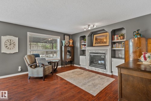 9 Landon Drive, Spruce Grove, AB - Indoor Photo Showing Living Room With Fireplace