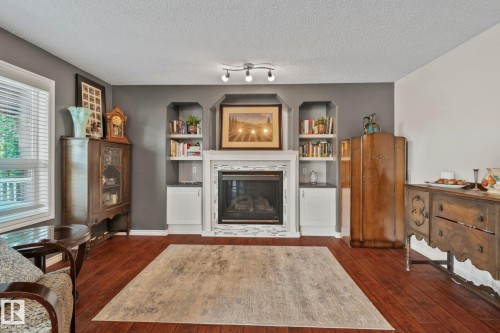 9 Landon Drive, Spruce Grove, AB - Indoor Photo Showing Living Room With Fireplace