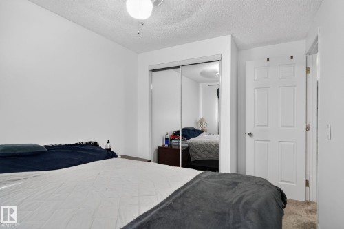 Bedroom featuring white walls and a ceiling fan with integrated lighting - 1344 Lakewood Road West Nw, Edmonton, AB - Indoor Photo Showing Bedroom