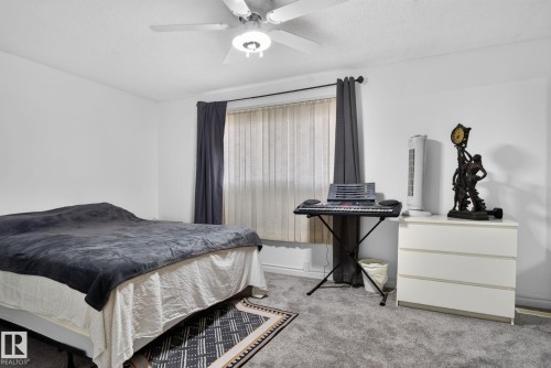 Room featuring neutral wall tones and gray carpeting - 1344 Lakewood Road West Nw, Edmonton, AB - Indoor