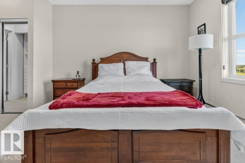 Recessed lighting, light neutral wall color, and carpeted flooring - #423 320 Ambleside Li Sw, Edmonton, AB - Indoor Photo Showing Bedroom