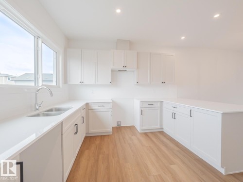 17334 6A Street Ne, Edmonton, AB - Indoor Photo Showing Kitchen With Double Sink