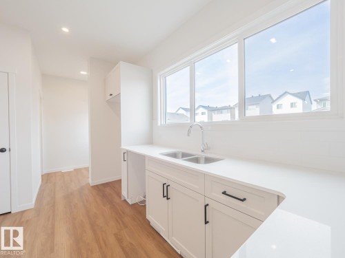 17334 6A Street Ne, Edmonton, AB - Indoor Photo Showing Kitchen With Double Sink