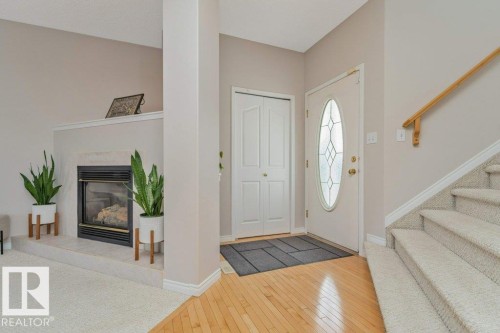1072 Barnes Way Sw, Edmonton, AB - Indoor Photo Showing Other Room With Fireplace