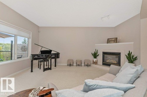 1072 Barnes Way Sw, Edmonton, AB - Indoor Photo Showing Living Room With Fireplace