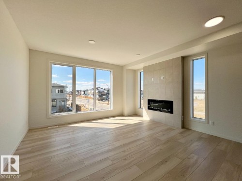 124 Westwind Drive, Spruce Grove, AB - Indoor Photo Showing Living Room With Fireplace