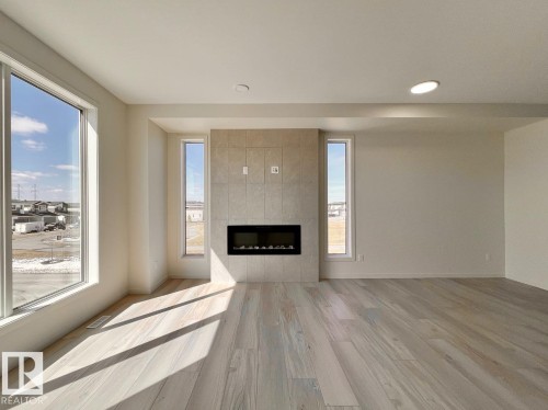 124 Westwind Drive, Spruce Grove, AB - Indoor Photo Showing Living Room With Fireplace