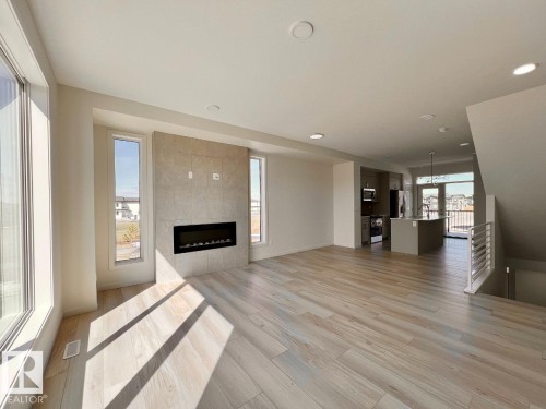 124 Westwind Drive, Spruce Grove, AB - Indoor Photo Showing Other Room With Fireplace
