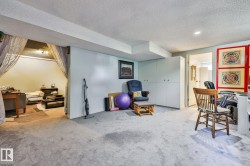 Recessed lighting, light-toned carpeting, built-in cabinetry, and a separate carpeted area - 