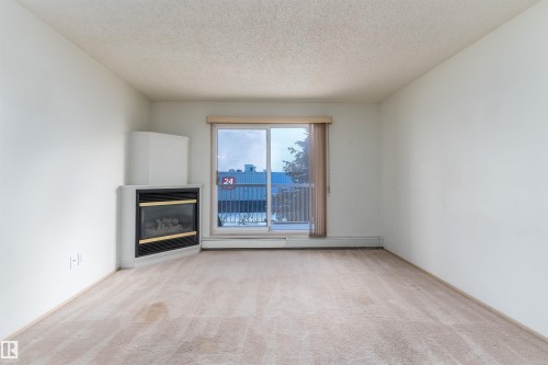 #306 4220 139 Av Nw, Edmonton, AB - Indoor Photo Showing Other Room With Fireplace