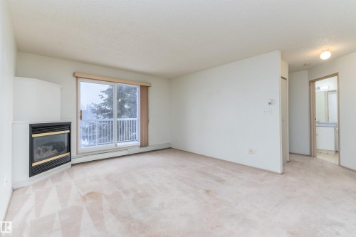 #306 4220 139 Av Nw, Edmonton, AB - Indoor With Fireplace
