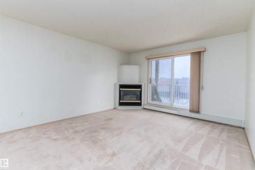 #306 4220 139 Av Nw, Edmonton, AB - Indoor Photo Showing Other Room With Fireplace