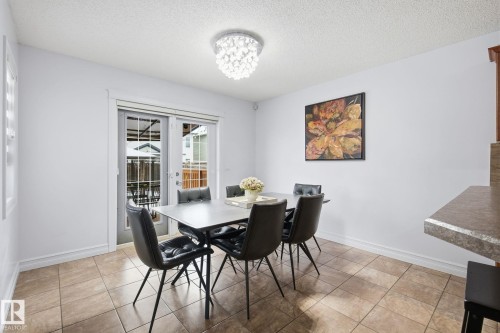 Recessed lighting, tile flooring, and sliding glass doors - 3016 24 Ave Nw, Edmonton, AB - Indoor Photo Showing Dining Room